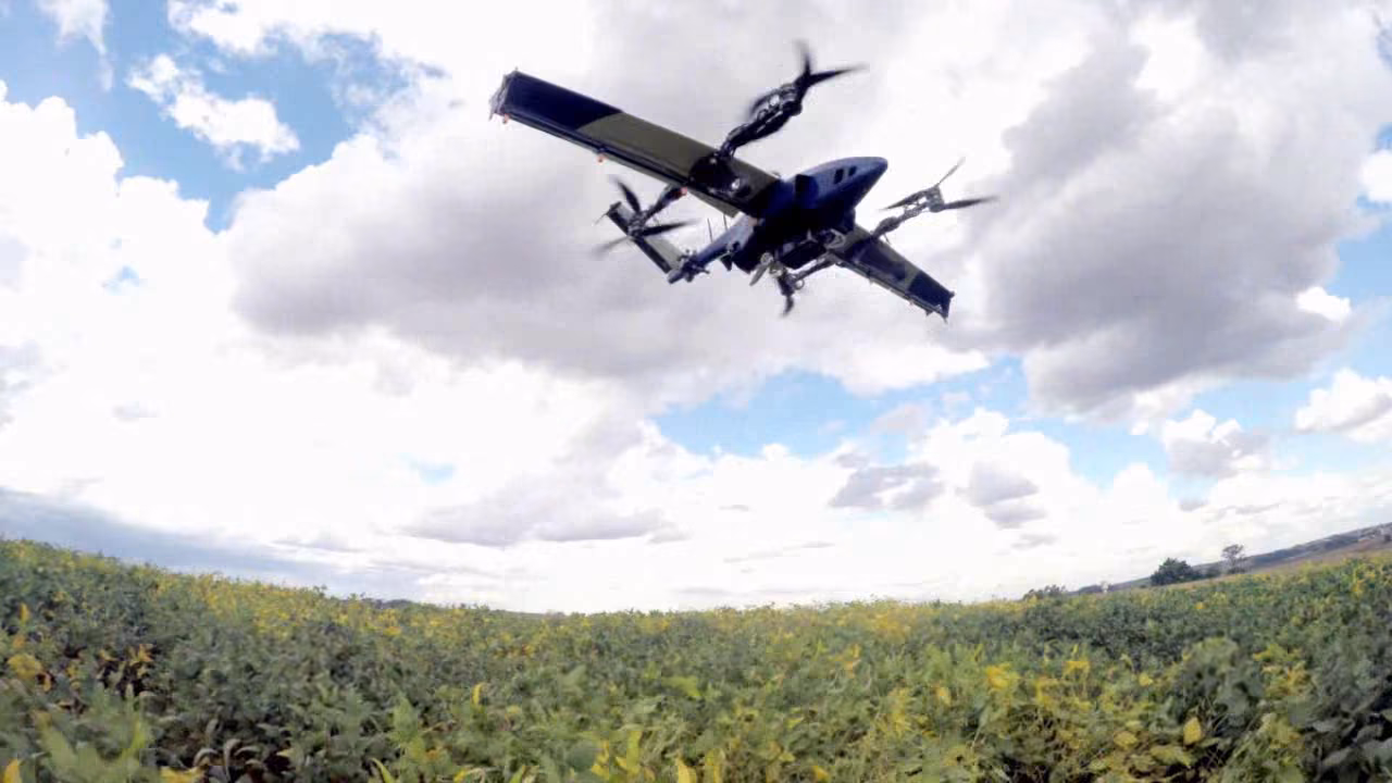 ModelWorks' Dronemog agricultural drone in flight over a soybean field